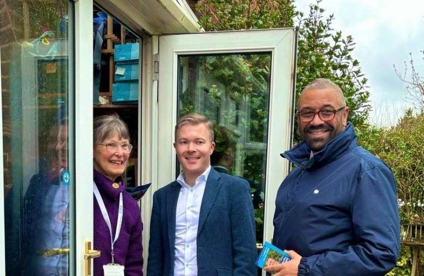 Bradley with Home Secretary, James Cleverly MP, meeting residents